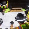 high visibility clothing and halo hat worn by construction workers at night