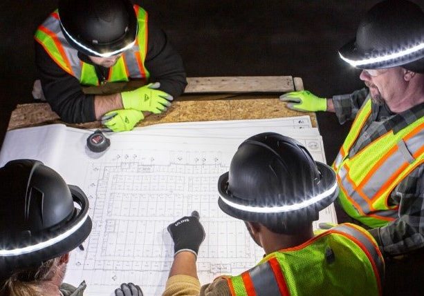 high visibility clothing and halo hat worn by construction workers at night