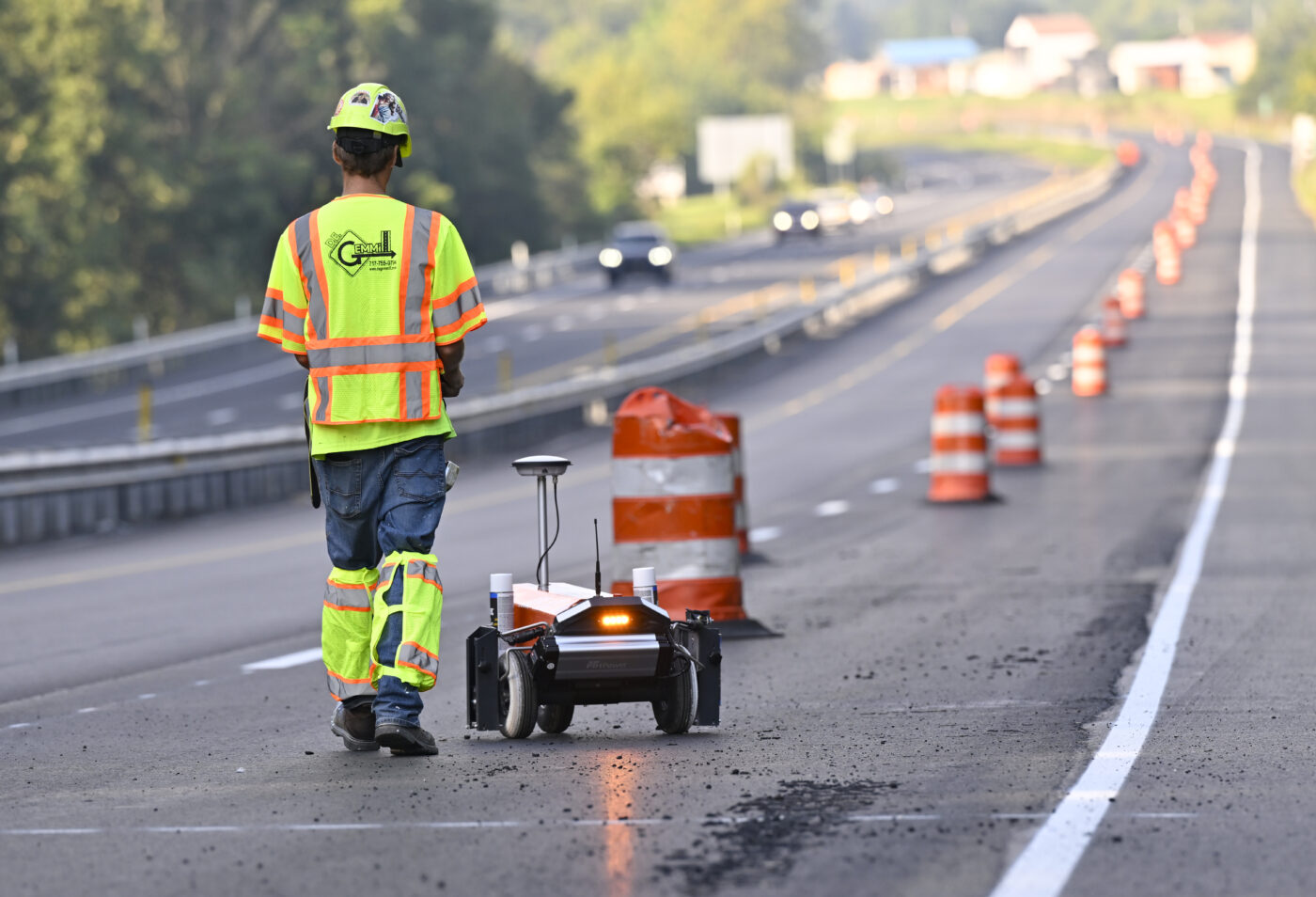 Robot and DE Gemmill worker on the road painting lines